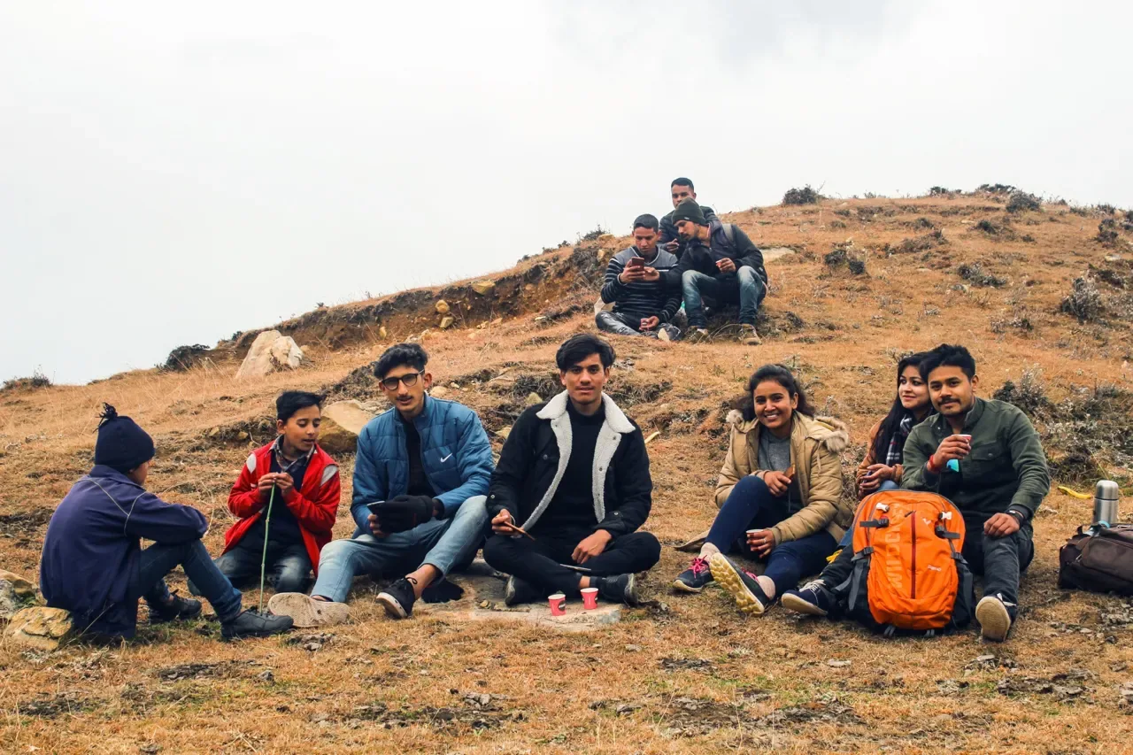 Travellers sharing chai on a hilltop